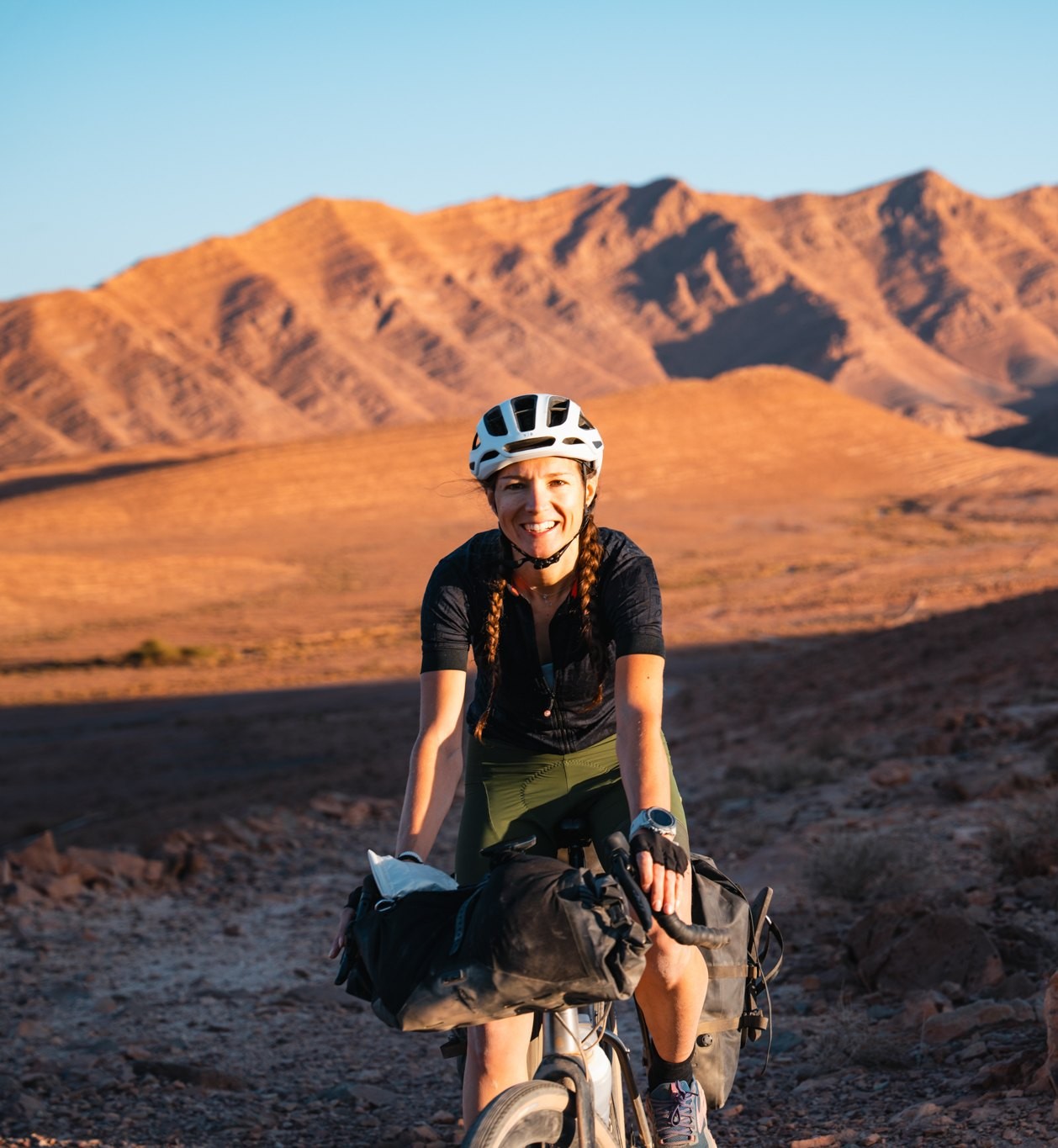Charlotte Martin riding in the mountains