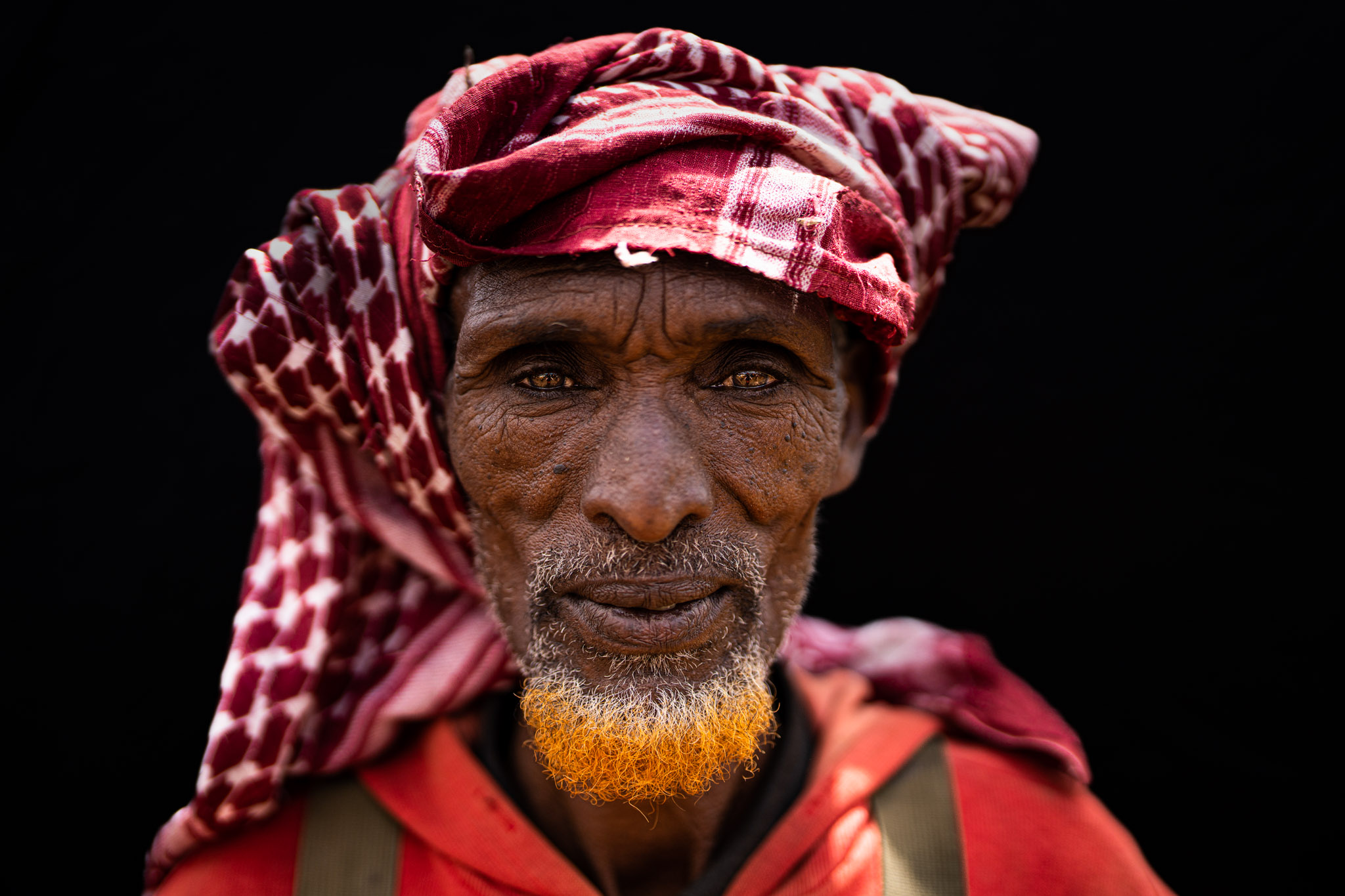 Woman with red headscarf