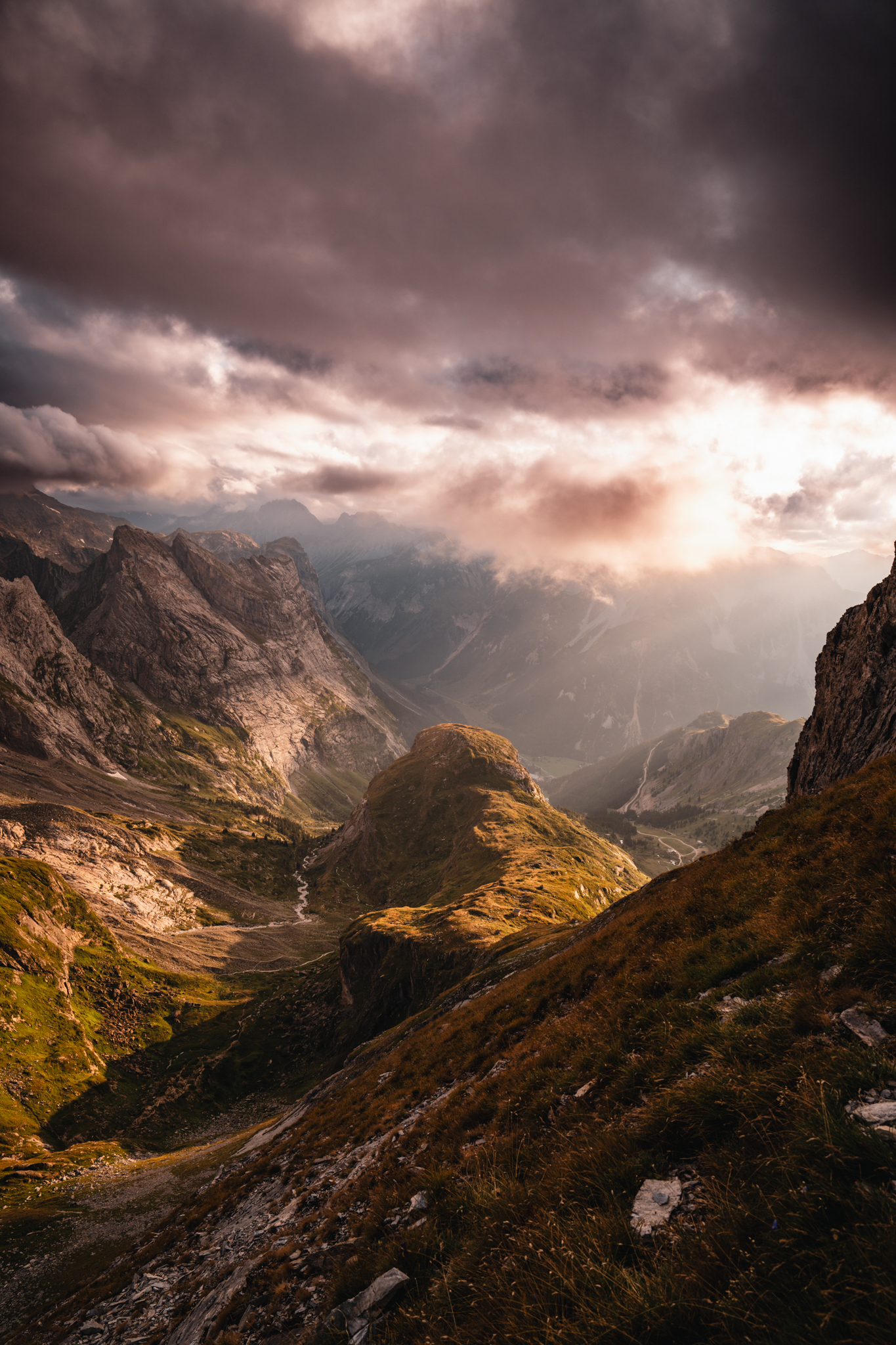 Stormy mountain valley at sunset