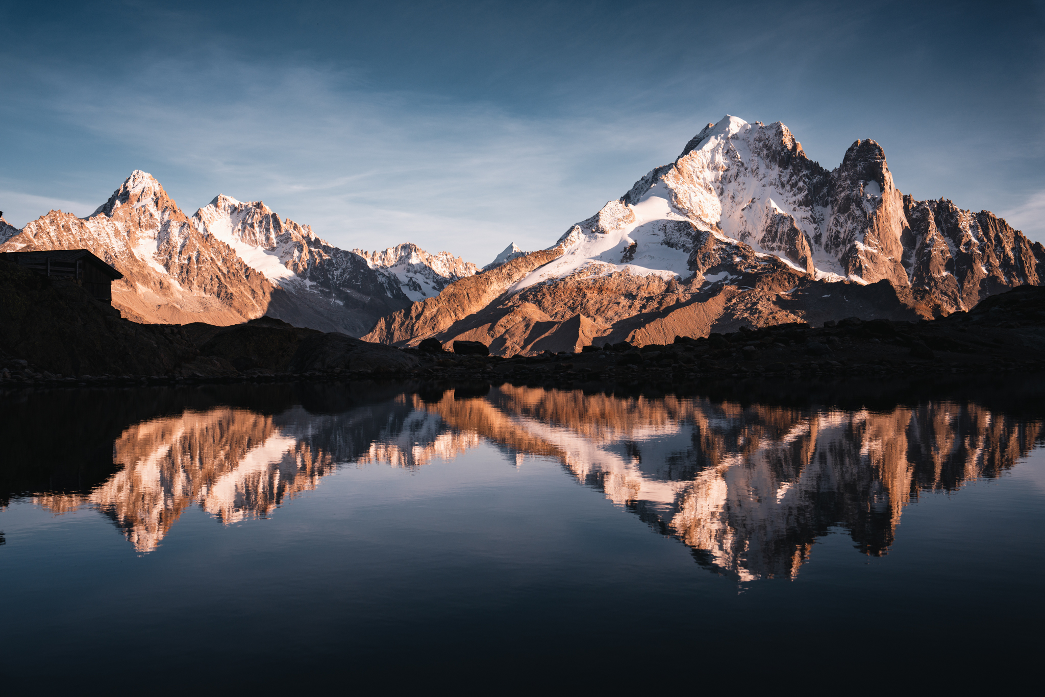 Panoramic alpine lake reflection
