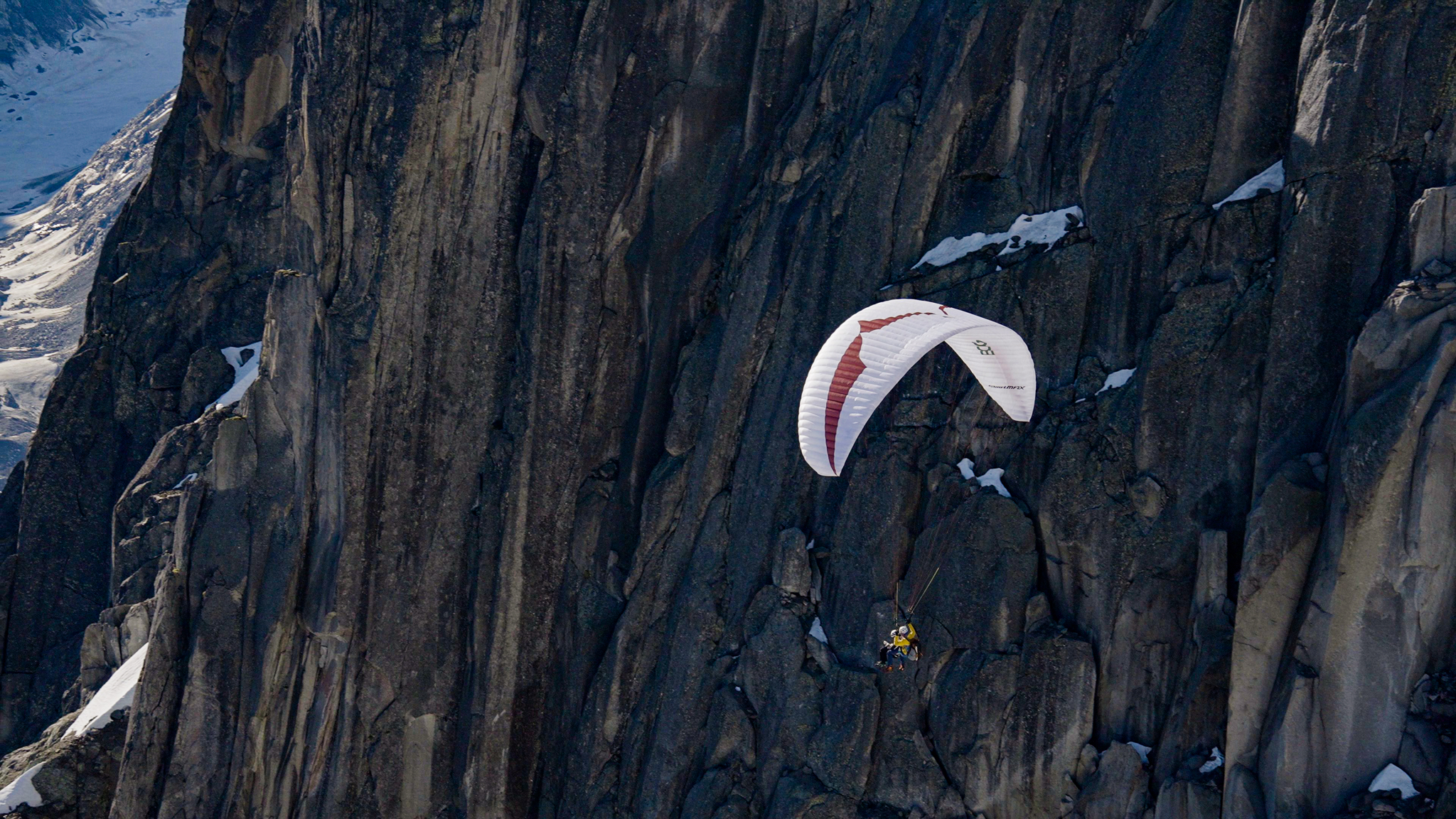 Paragliding over granite cliffs