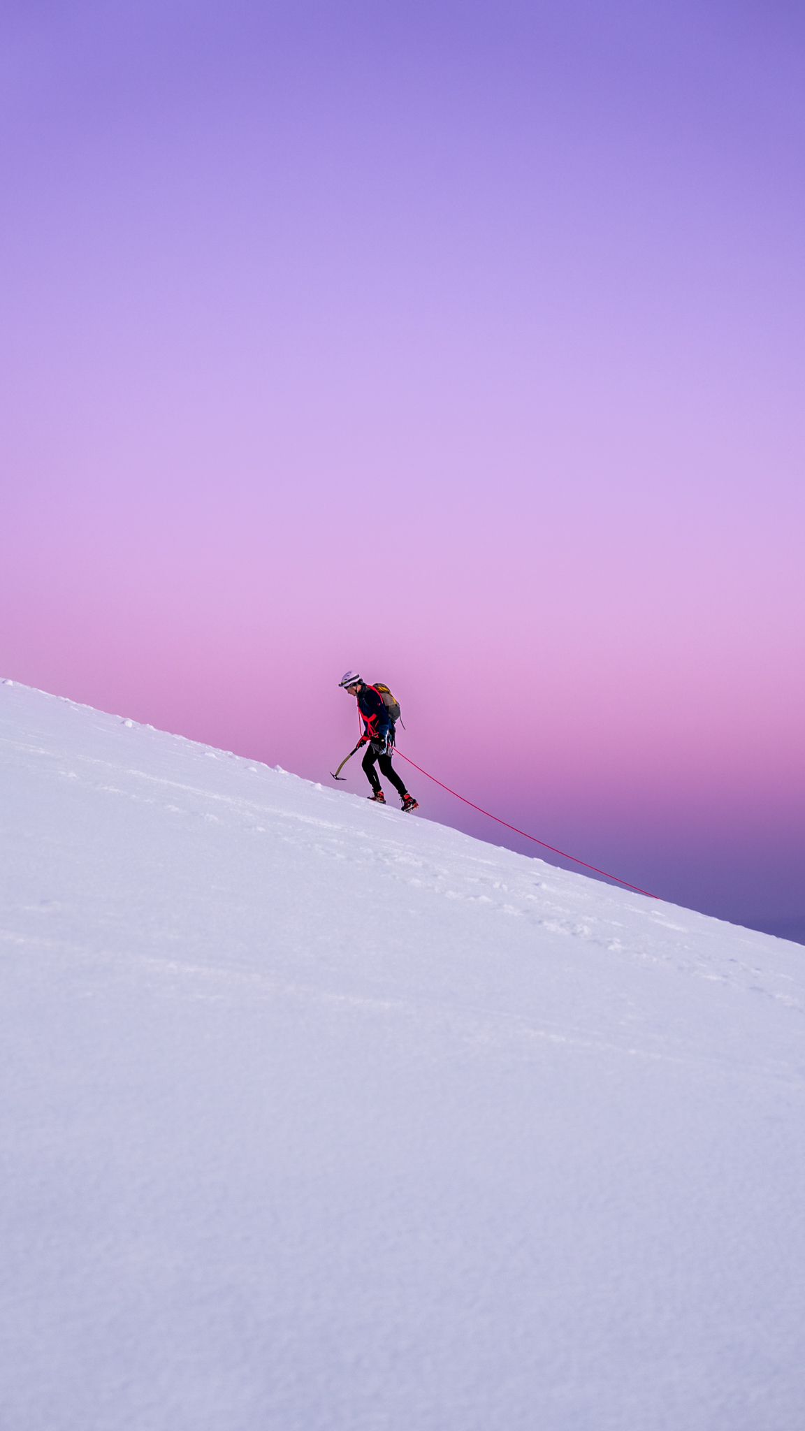 Ski touring in purple light
